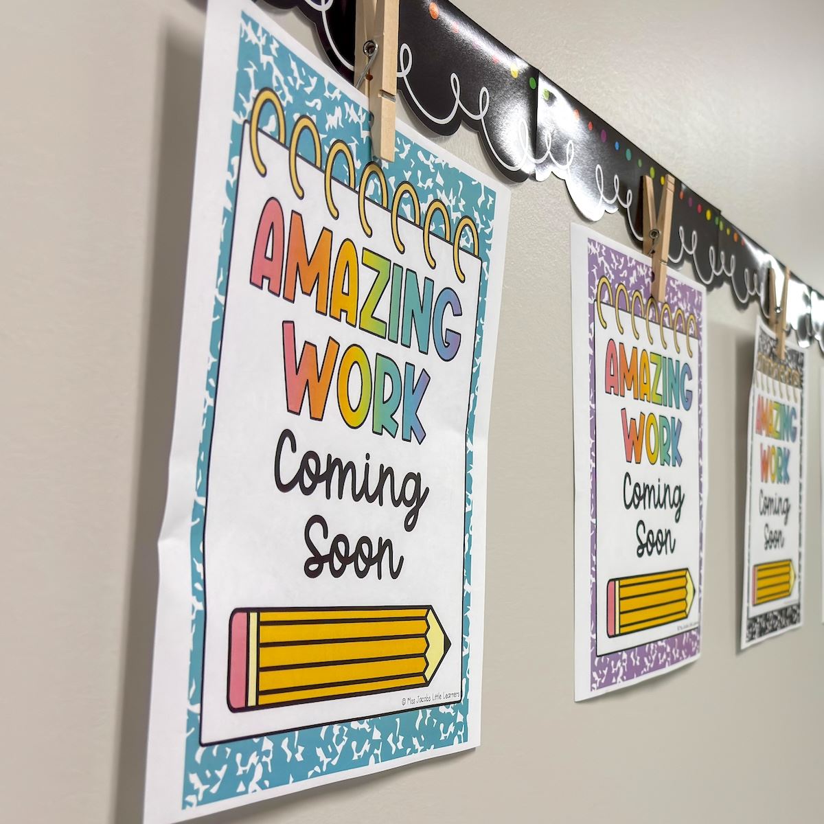  Flyers pinned to a wall that read "Amazing work coming soon"